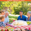 A family enjoying an outdoor meal under a pop-up mesh food covers tent with various foods displayed.