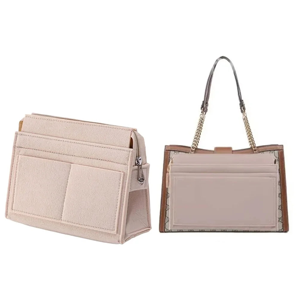 A light pink felt multi-pocket purse organizer insert with a gold chain strap.