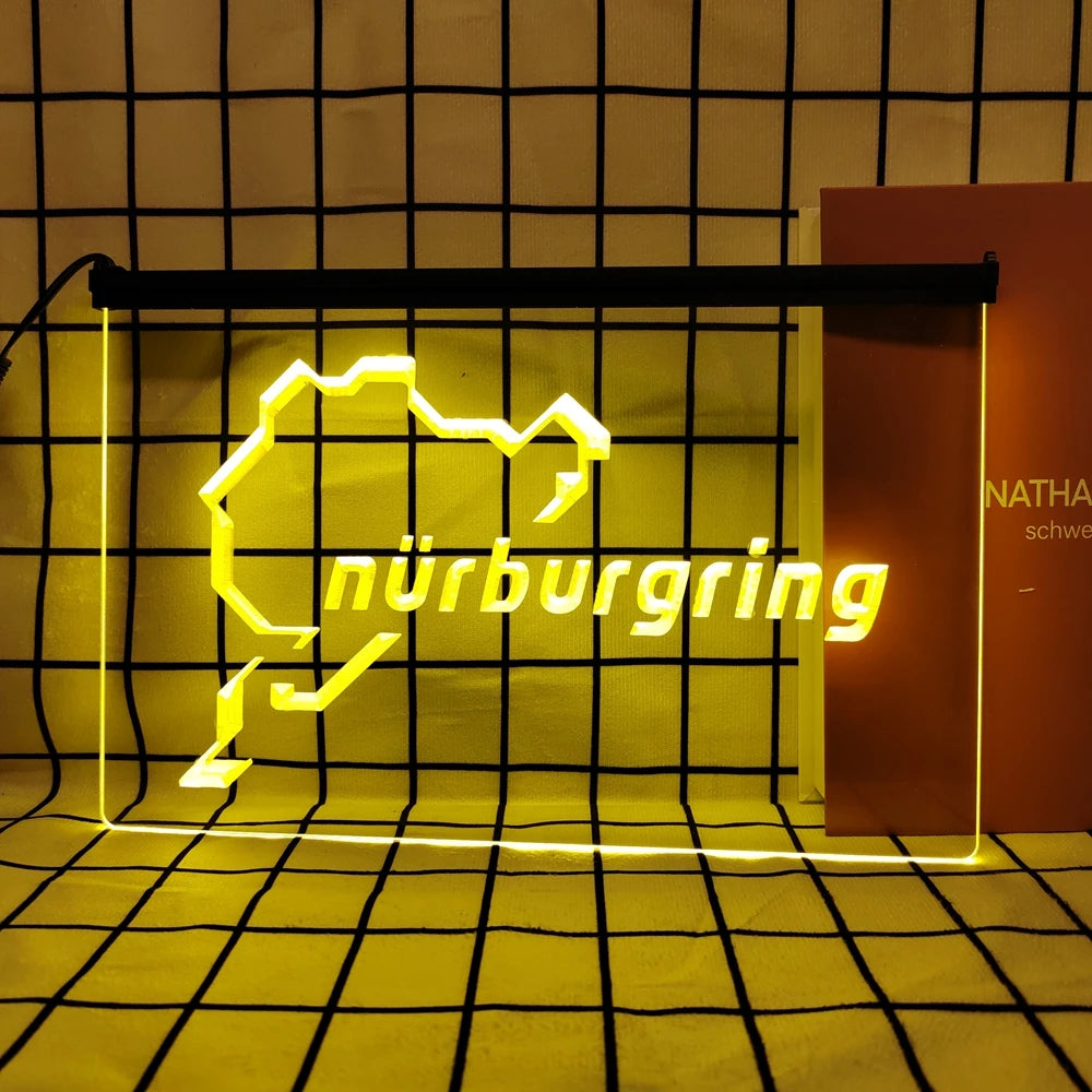 A neon sign shaped like the state of Nuremberg in bright yellow light against a grid background.