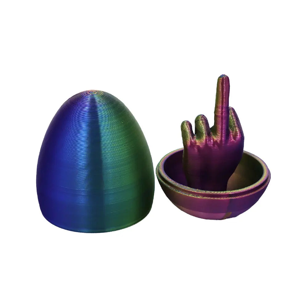 A glossy, egg-shaped desk decor item with a textured surface and a hand gesture design.