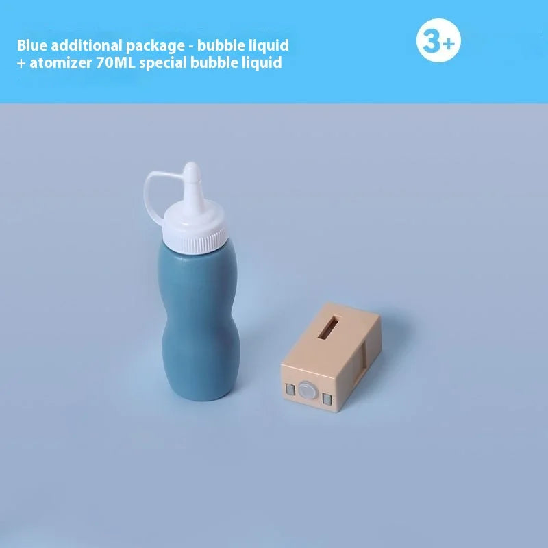 A blue bottle of bubble liquid and an atomizer are shown next to a beige box for the Magic Smoke Bubble Machine.