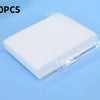 A white laundry color absorbing paper sheet packaged in clear plastic, shown against a light blue background.