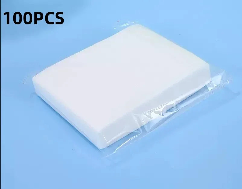 A white laundry color absorbing paper sheet packaged in clear plastic, shown against a light blue background.