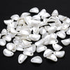 A pile of 100 white acrylic pearl spacer beads for jewelry making