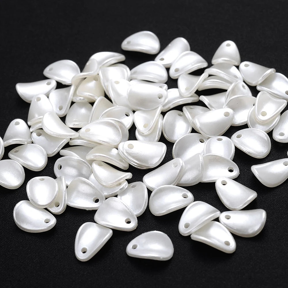 A pile of 100 white acrylic pearl spacer beads for jewelry making