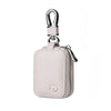 A light pink PU leather protective case for earbuds with an anti-lost hook.