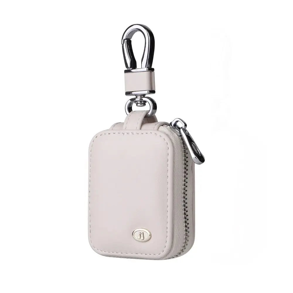 A light pink PU leather protective case for earbuds with an anti-lost hook.