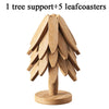 A wooden tree design coaster set featuring one tree support and five leaf coasters.