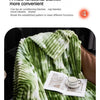 A green and white striped multi-functional blanket draped on a surface.