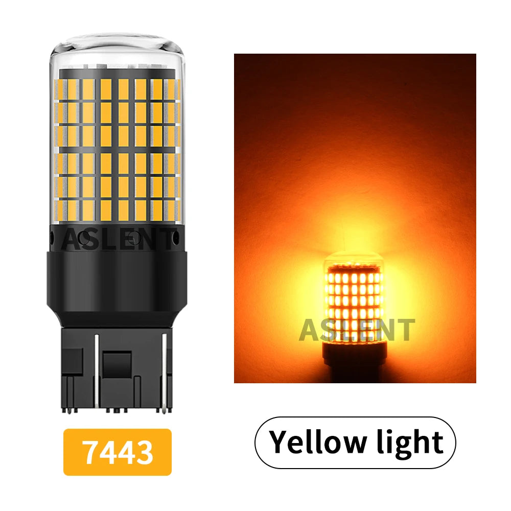 A yellow LED light bulb with a cylindrical glass envelope and black base, shown next to a glowing light source.