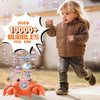 A young child is blowing bubbles while interacting with an orange crab bubble blower toy.