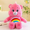 Peluche Kawaii Rainbow Care Bears rosa con cara sonriente y detalles de corazón.