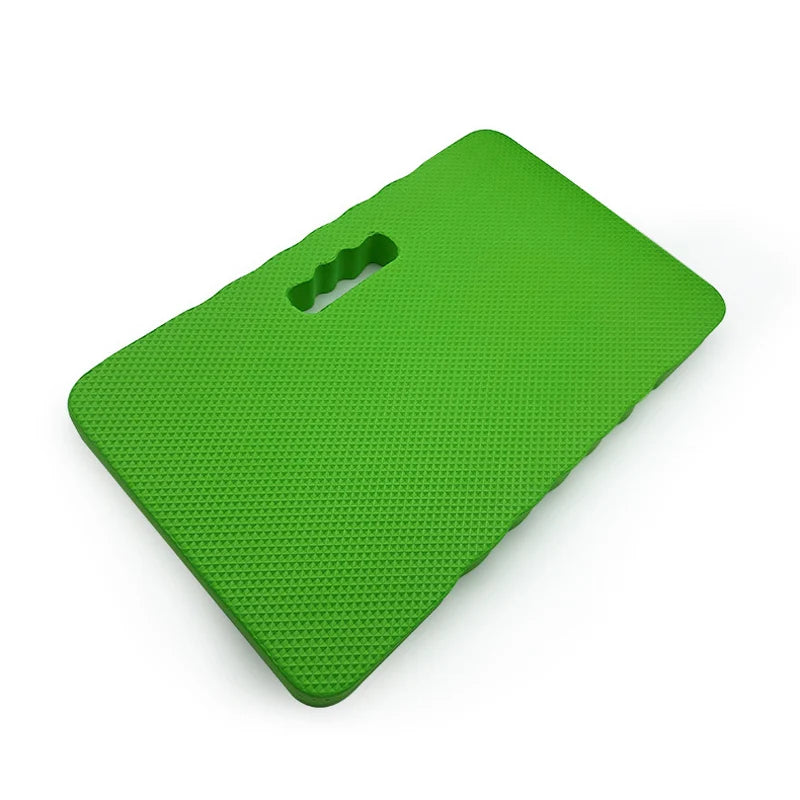 A bright green high-density foam kneeling pad with a handle, designed as a waterproof, non-slip knee cushion.
