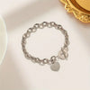 Bracelet en acier inoxydable avec pendentif double cœur