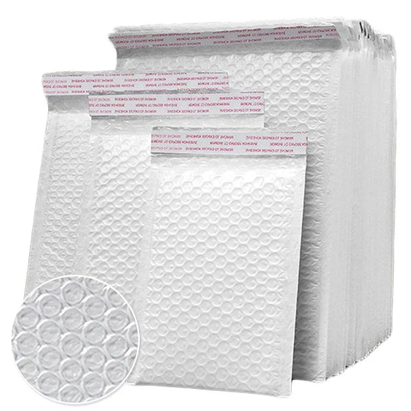 A stack of white padded bubble mailers with self-seal closures.