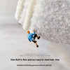 A person is shown jumping onto a thick, white, fluffy rug or mat.