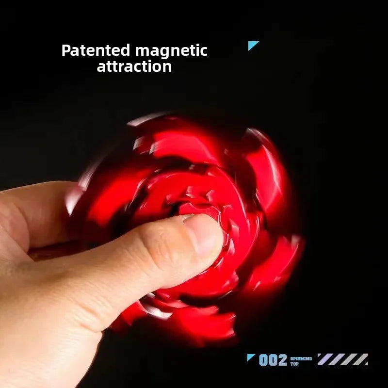 A hand is interacting with a bright red, swirling magnetic object used for fidgeting or stress relief.