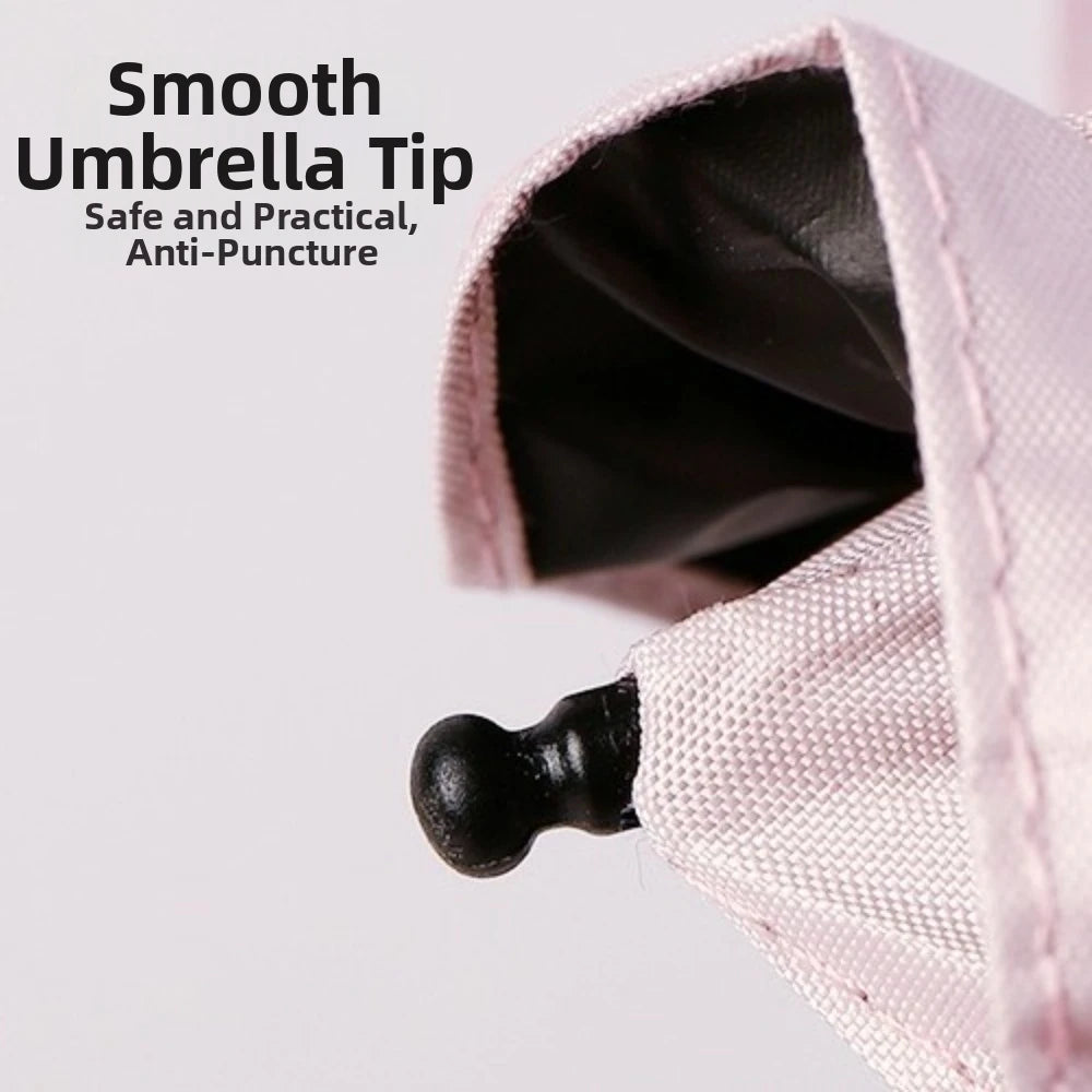 Close-up of a pink umbrella tip showing the smooth anti-puncture design.