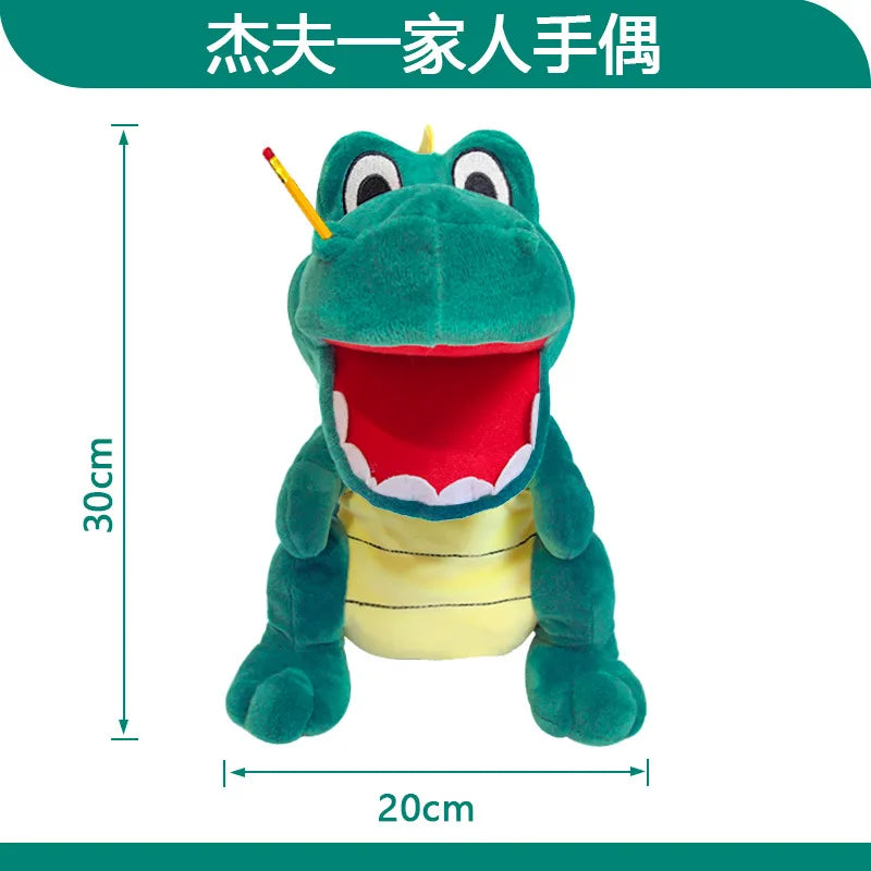 A green plush toy of a zombie boy with an open mouth and a yellow belly, used as a hand puppet.