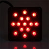A black LED trailer tail light with multiple red circular lights illuminating the surface below.