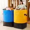 A pair of heavy-duty storage bags, one blue and one yellow, used for storing items like comforters or clothing.