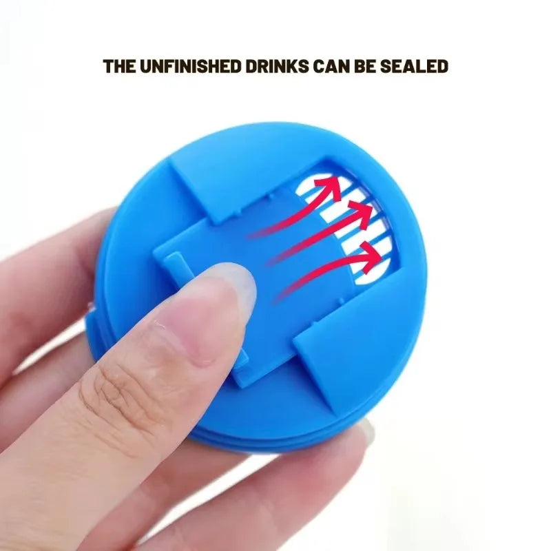 A hand holds a blue reusable leakproof can cover, demonstrating how unfinished drinks can be sealed.
