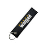 Black nylon keychain with embroidered wanted text and a steel spring clip