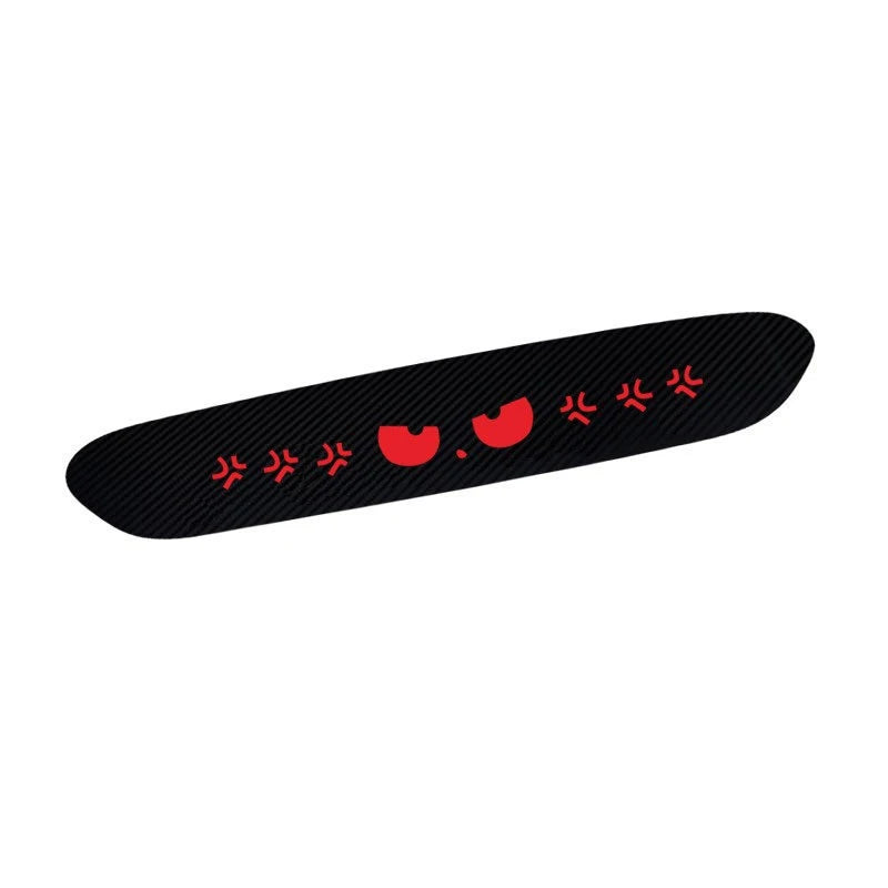 A black brake light sticker featuring a devil eye design with red accents.