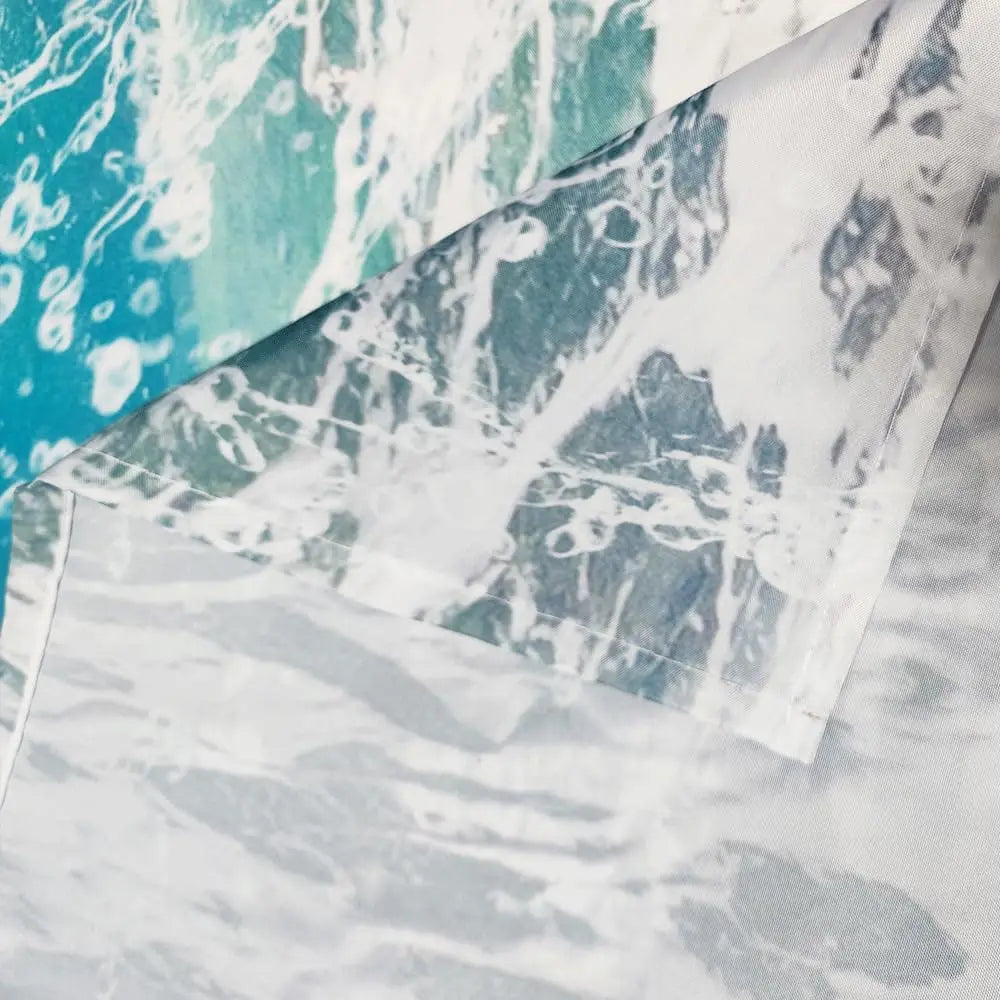 A close-up of a playful raccoon riding a shark design on a shower curtain fabric.
