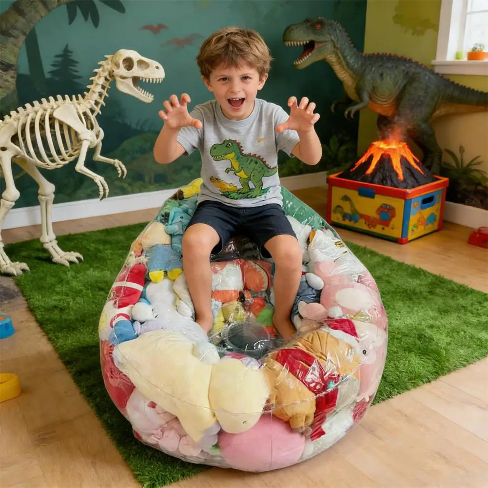 An inflatable plush toy storage bag filled with various stuffed toys on a green rug.