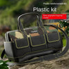 A black and olive camouflage plastic kit tool bag with a reinforced base is shown outdoors.
