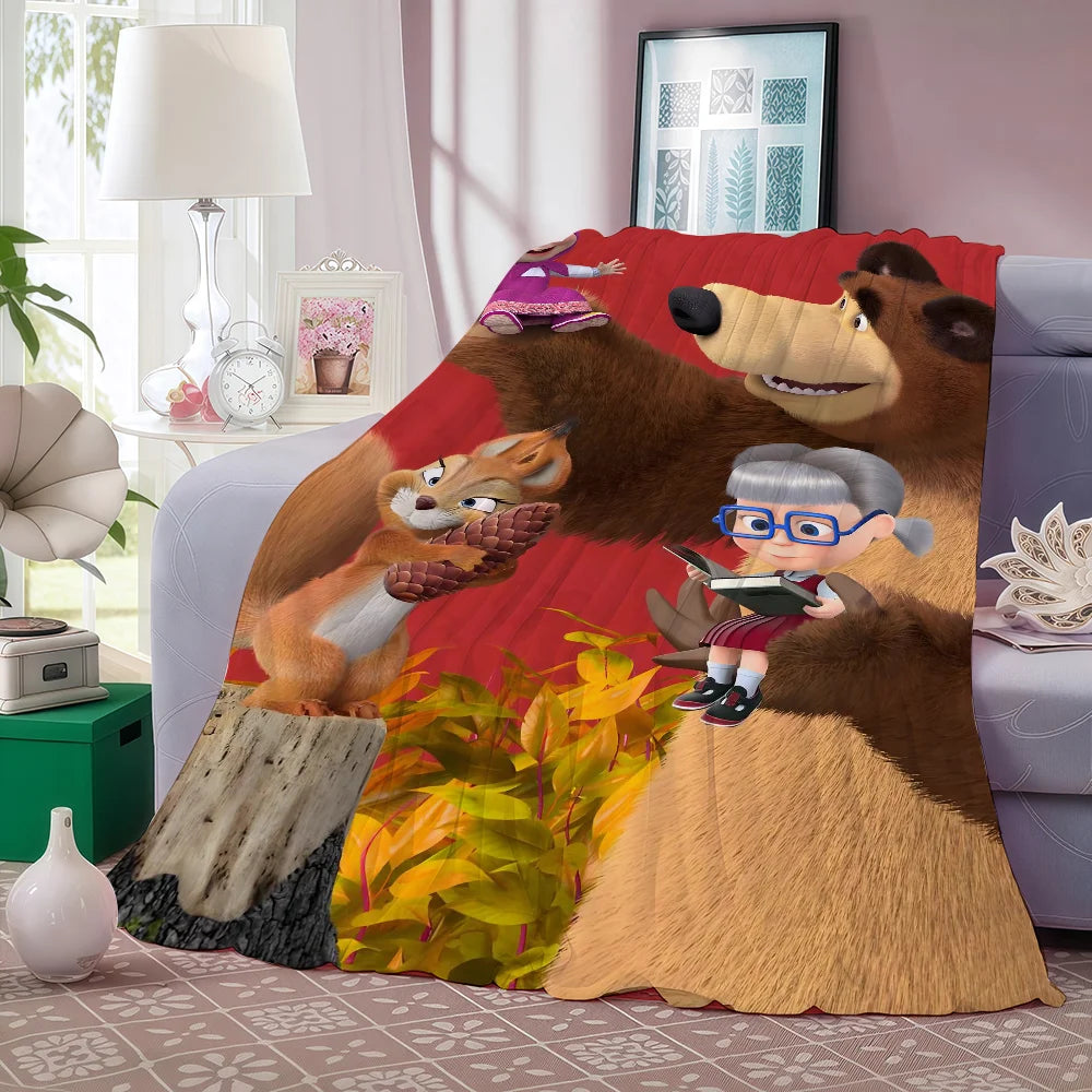 A fleece throw blanket featuring characters from Masha and the Bear cartoon on a red background.