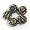 A set of five resin rhinestone beads with a two-tone gold and black striped design.