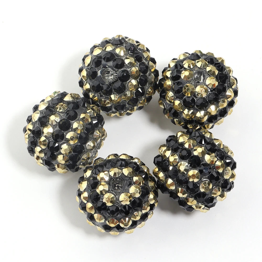 A set of five resin rhinestone beads with a two-tone gold and black striped design.