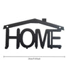 Black rustic iron wall hooks shaped like the word HOME for home organization
