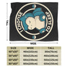 A black plush throw blanket featuring a graphic of a sleeping baby inside a circular design.