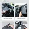 A collection of dark gray reusable microfiber cleaning cloths being used for various household and car cleaning tasks.