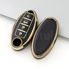A pair of gold and black TPU car key case covers showing various key shapes.