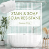 Clear Premium PEVA shower curtain liner with plastic hooks hanging over a white bathtub.