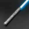 A close-up view of a Neo Pixel lightsaber with a glowing blue blade and an ornate hilt against a dark background.