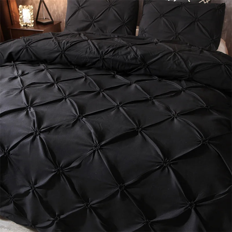 Black quilted comforter and pillow set for queen size bed