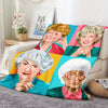 A colorful pop art blanket featuring portraits of the Golden Girls women.