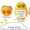 A yellow handmade crochet pocket hug doll with glasses and a positive message tag.