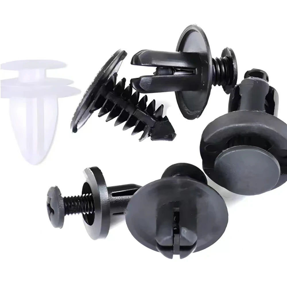 A set of black auto trim panel retainer clips and fasteners for secure body panel repair.