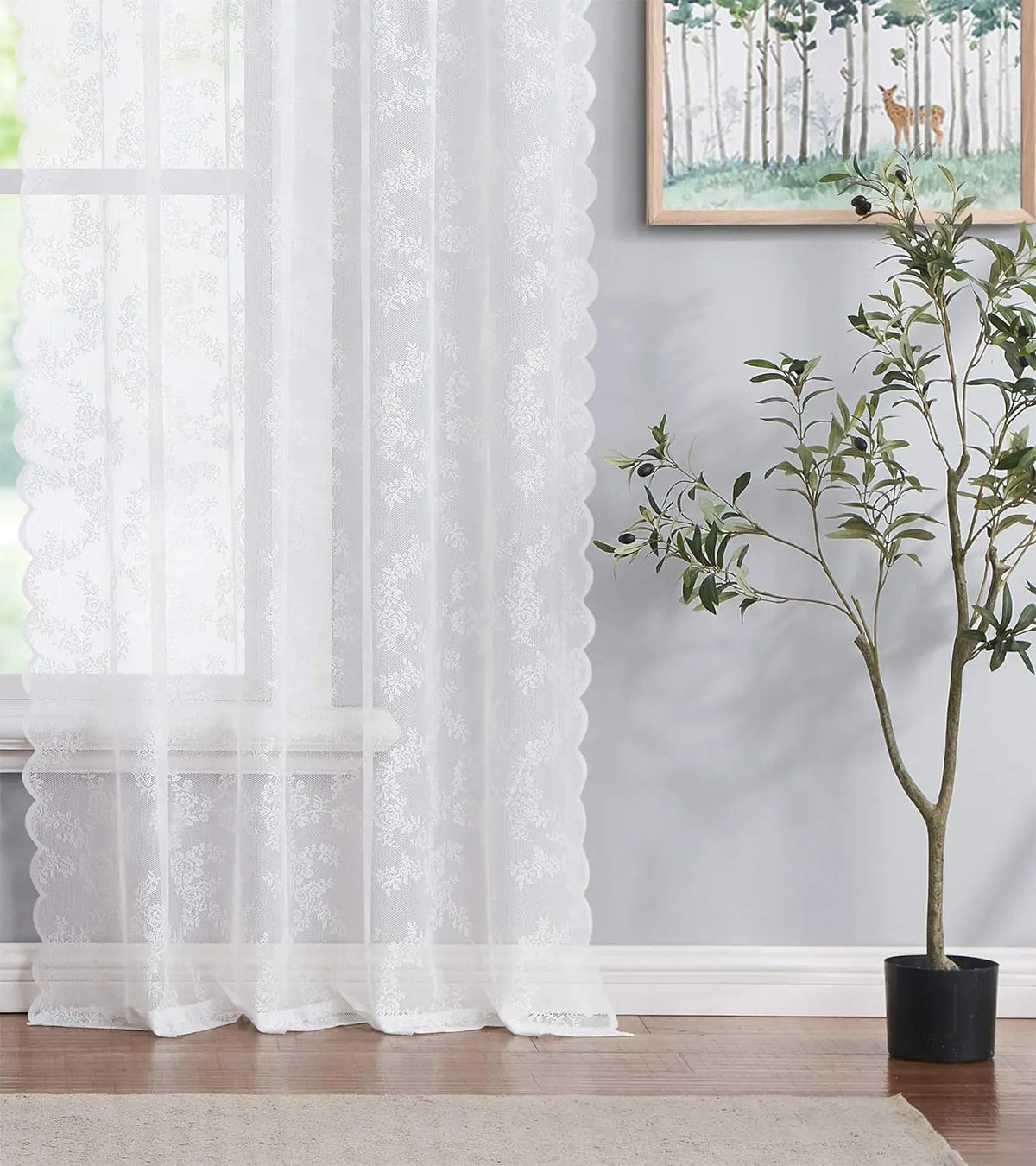 White vintage floral lace curtain panel filtering light in a window