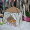 A beige and white foldable kids teepee play tent decorated with floral patterns and draped fabric.