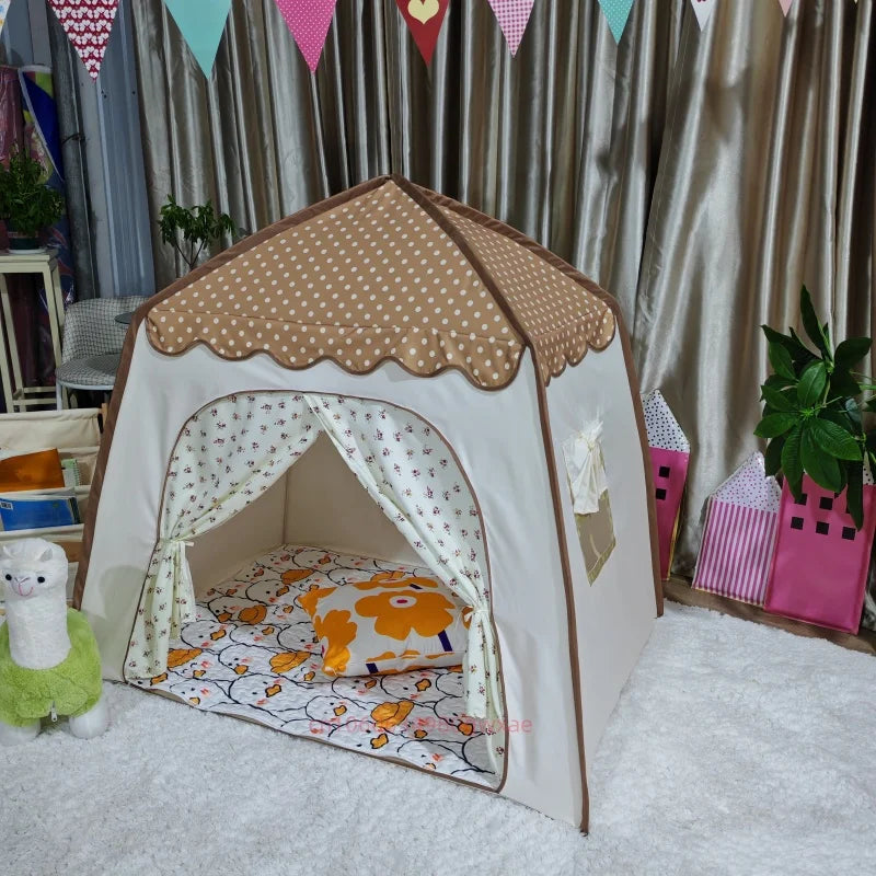 A beige and white foldable kids teepee play tent decorated with floral patterns and draped fabric.