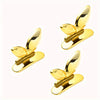 A pair of gold-colored touch-free toilet seat lifters with flush buttons.