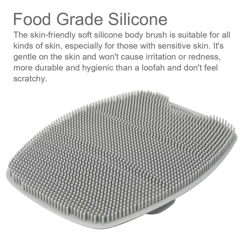 A gray silicone body brush with numerous small bristles is shown from above.