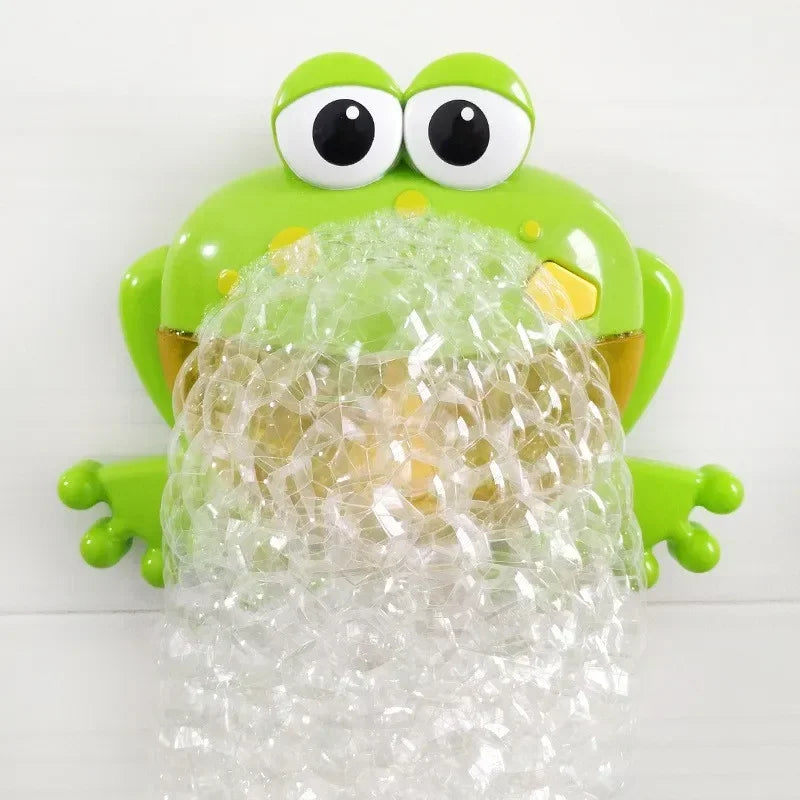 A bright green musical bubble maker bath toy with large eyes is shown pouring a stream of clear bubbles.